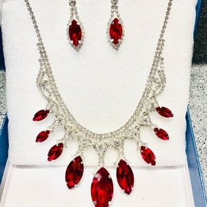 Women’s Ruby color costume jewelry set. Necklace and earrings with rhinestones.